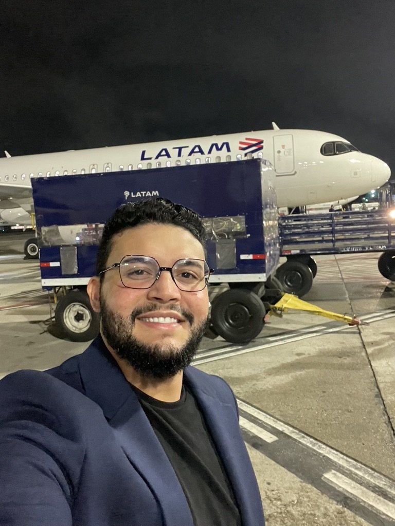 Portrait of Gabriel de Freitas Carvalho in a navy blazer and black shirt